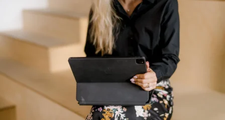 Lawyer holding a tablet, cropped at the shoulders