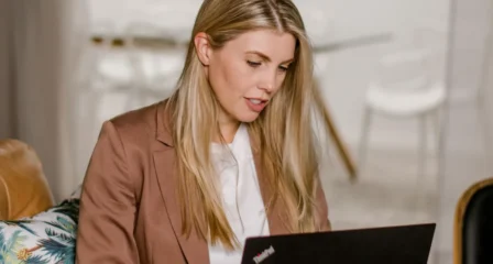 Lawyer working on a laptop in a welcoming office lounge
