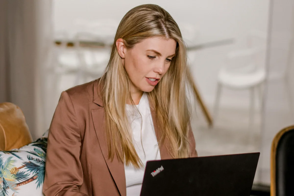 Lawyer working on a laptop in a welcoming office lounge